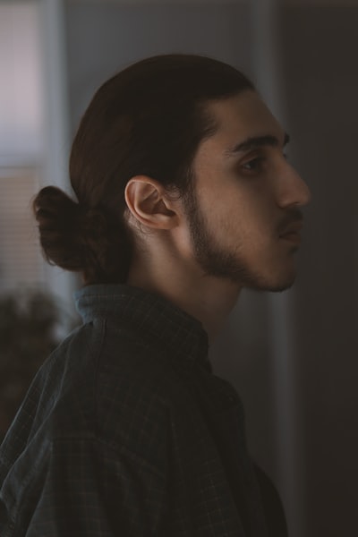 man in black jacket looking down